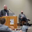 Thumbnail image of Commissioner Chad Peterson speaking at podium