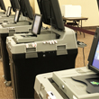 Thumbnail image of voting center machines lined up