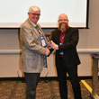 Thumbnail image of Commissioner Peterson receiving a gavel