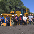 Thumbnail Image of the local officials digging into the ground with shovels