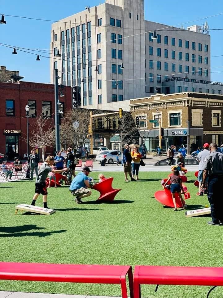 Image of people enjoying a nice day in Broadway Square in downtown Fargo