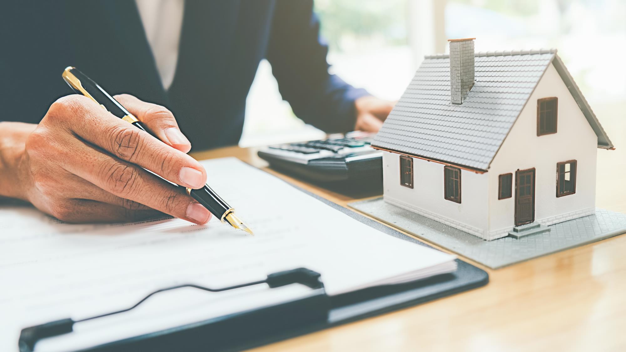 Image of a person calculating their property taxes at a desk