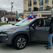 Image of a local veteran receiving a free car from Progressive. Cass County Veteran Service officers helped her receive this giveaway