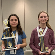 Image of the top two finishers in the state spelling bee. Luna Gasevic took first place and Merryn Johnson placed second. Both attend middle school in Cass County